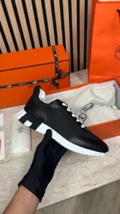 Hermès Sneakers Black orange H